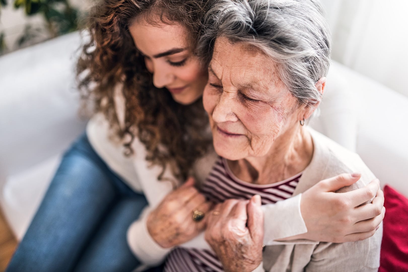 Young woman hugging grandmother